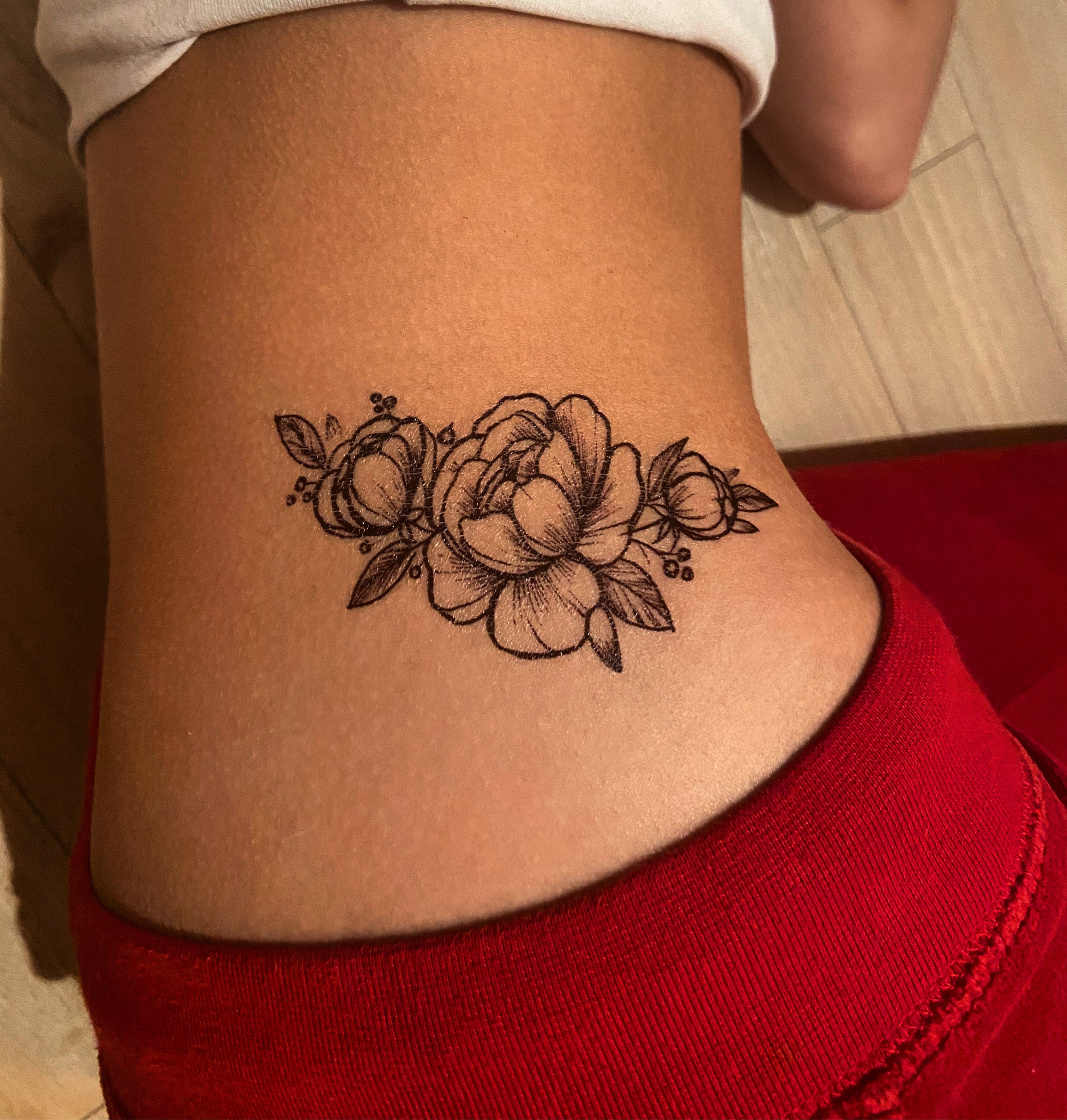 Black ink flower tattoos